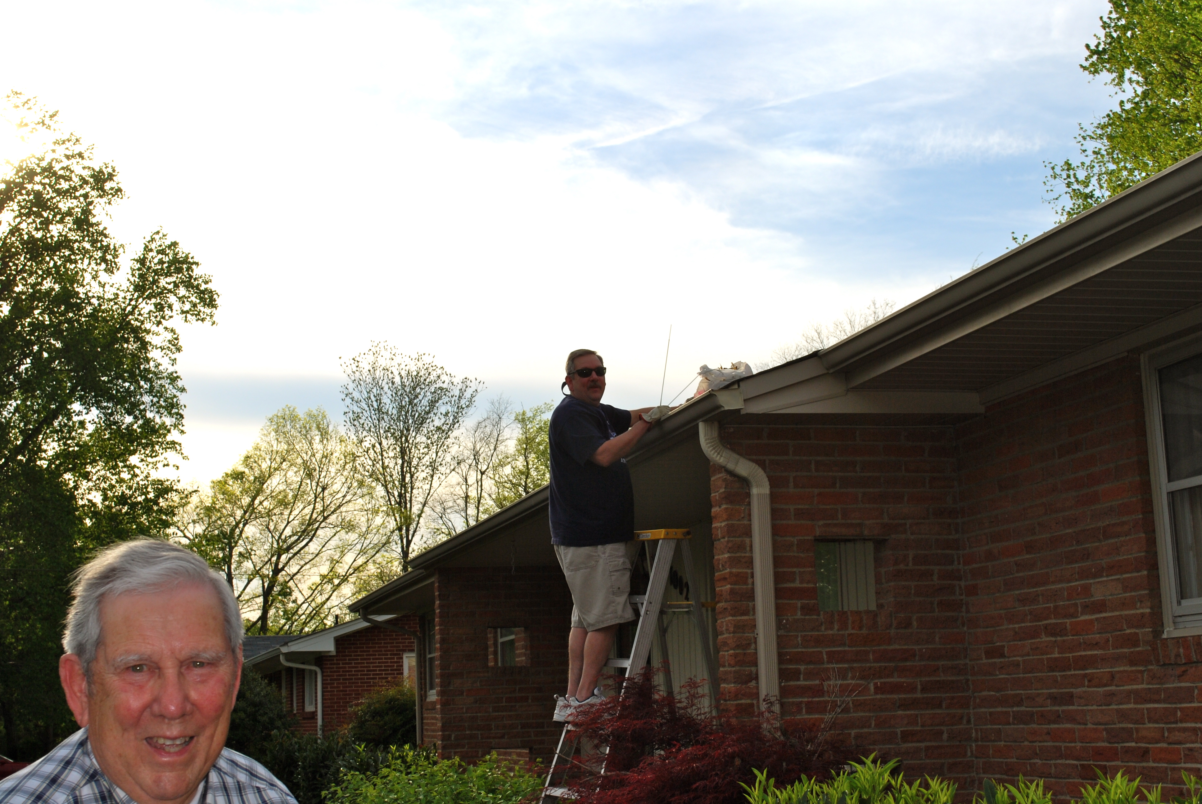 Alan was cleaning out the gutters for Granddaddy.